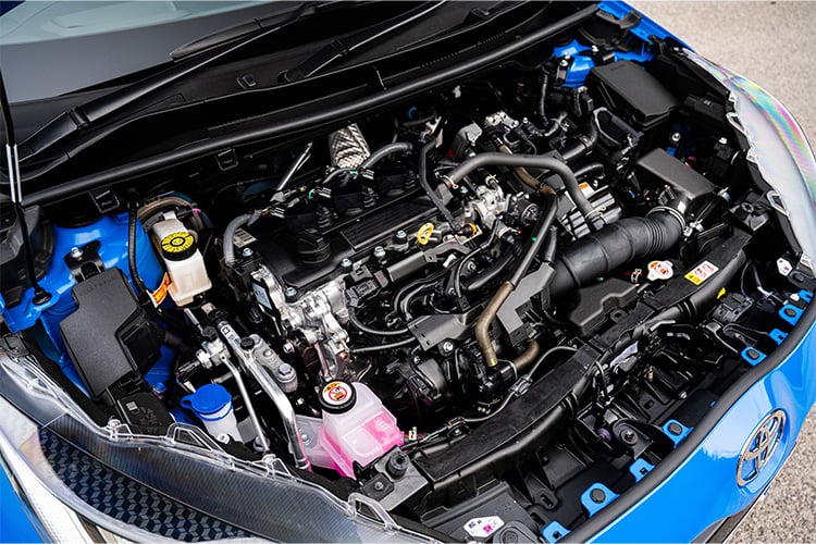 Detailed view of a Toyota car engine, showcasing intricate parts and systems under the hood