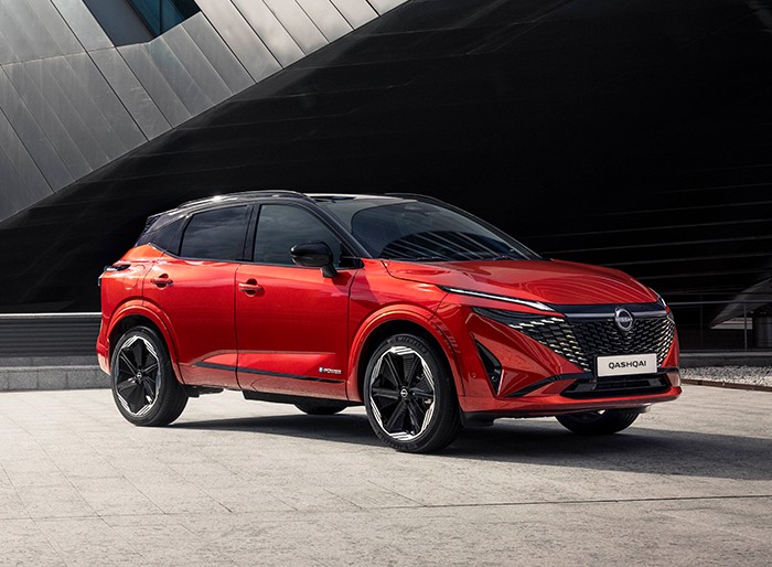 red qashqai exterior in a prism parking lot